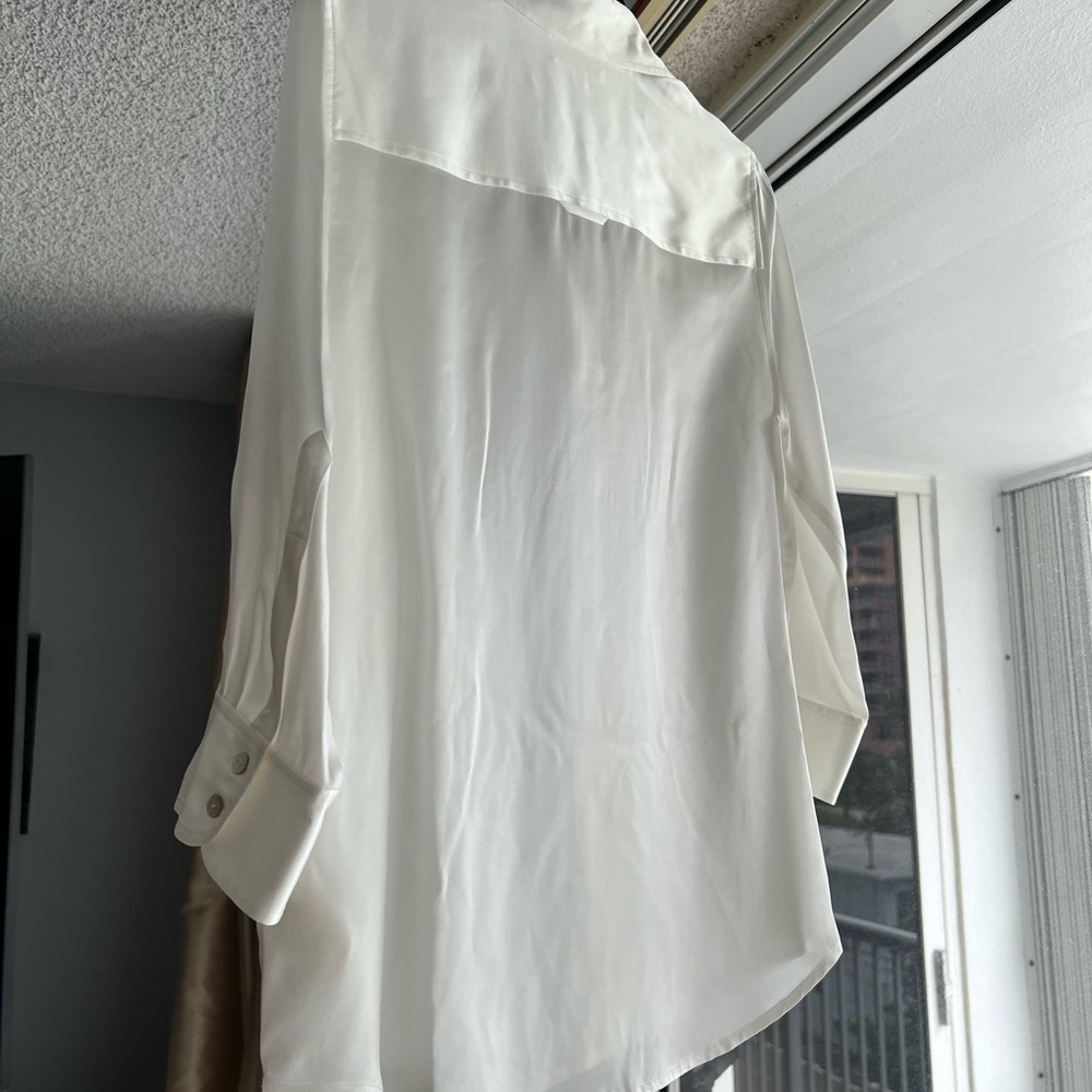 This is a L’Agence blouse in size medium
